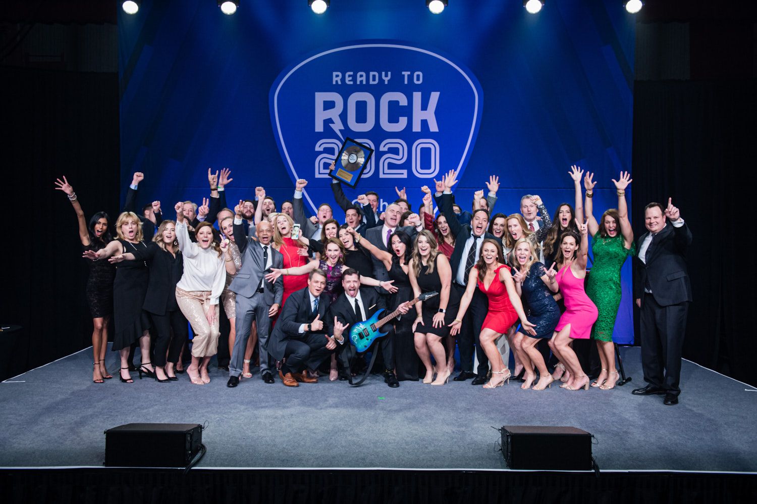 Sales team celebrating on the main stage