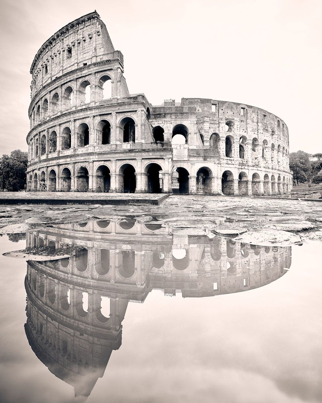 The Colosseum reflected in a puddle