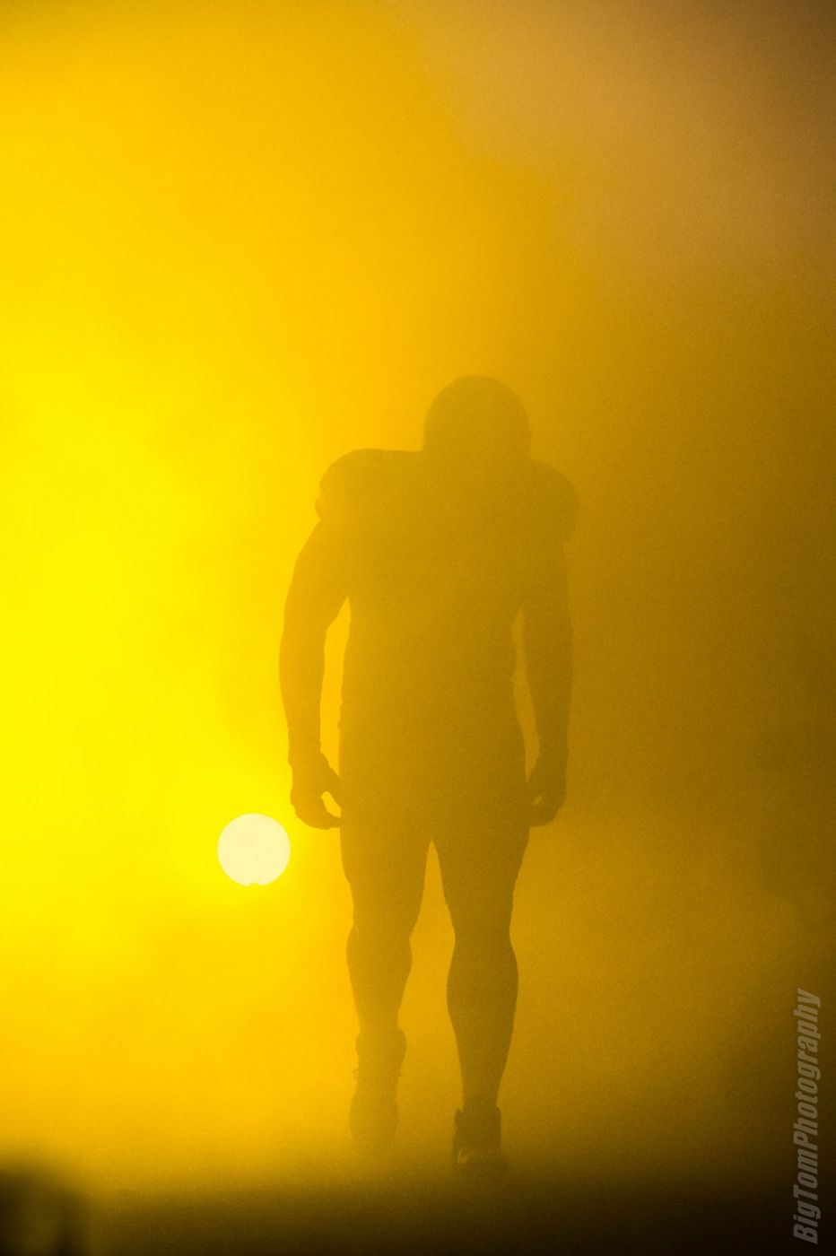 Player silhouette in gold fog